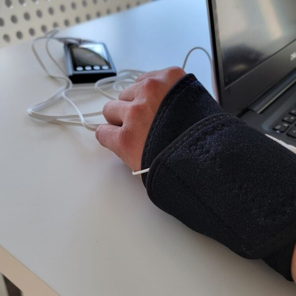 HiDow AcuWrist Wrap worn at desk